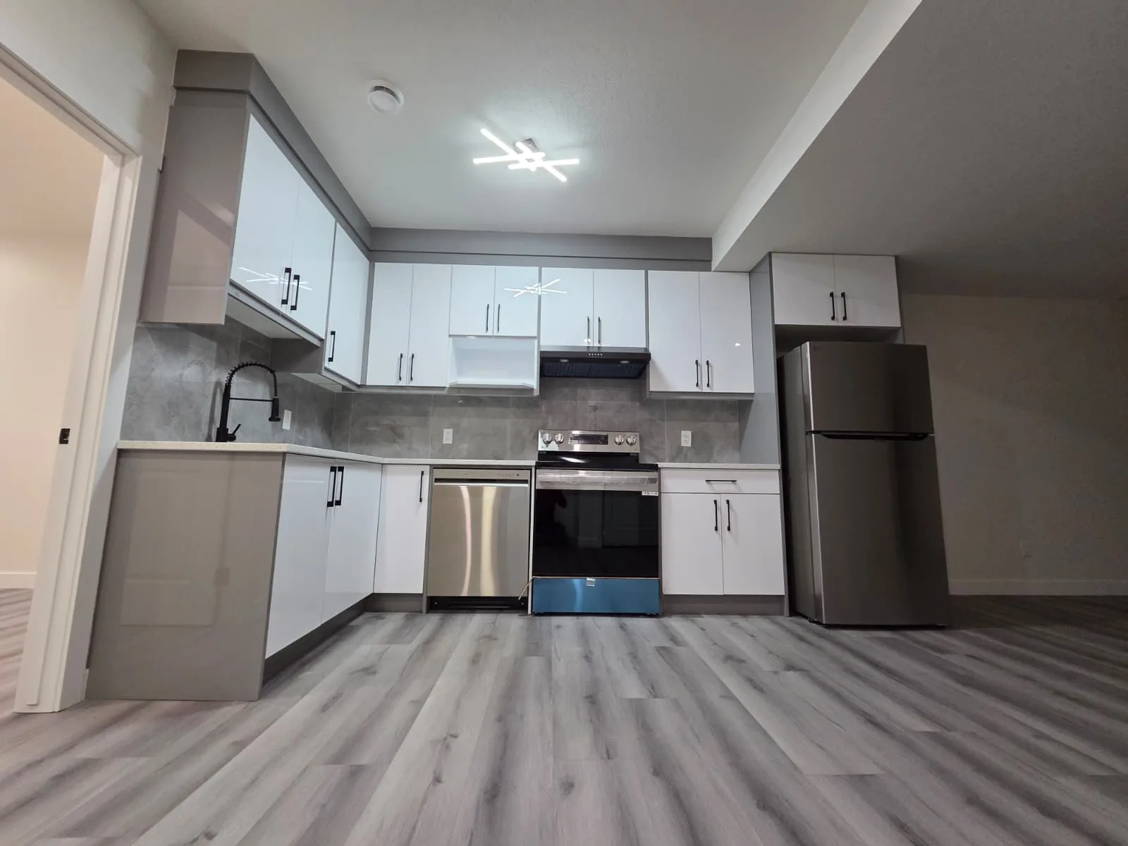 Bright white kitchen with island, Calgary