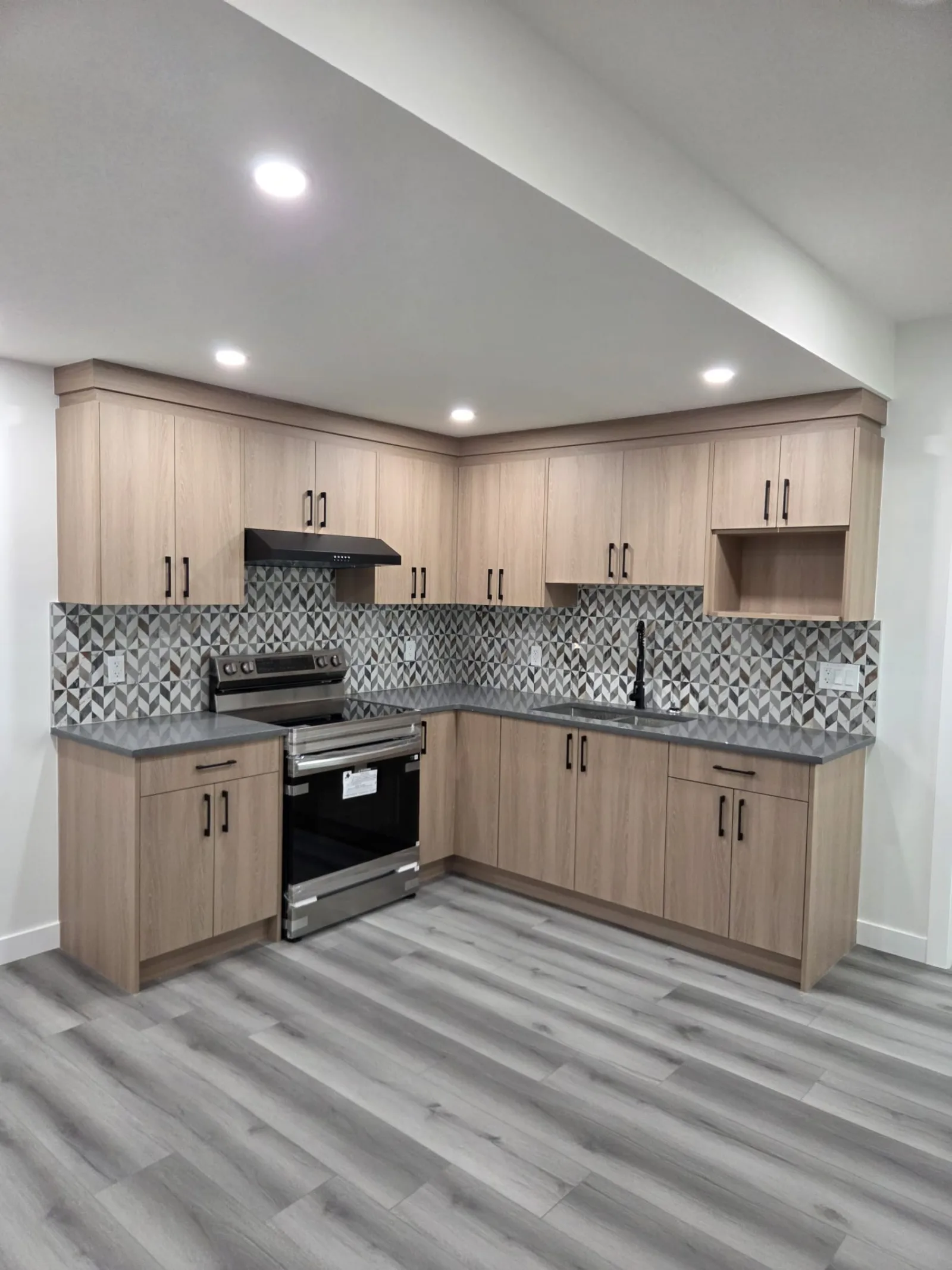 Vaulted-ceiling kitchen renovation by Titan Pro Developer, Calgary