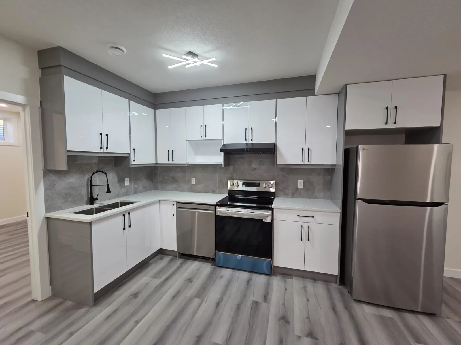 Modern kitchen renovation with wood flooring, Calgary